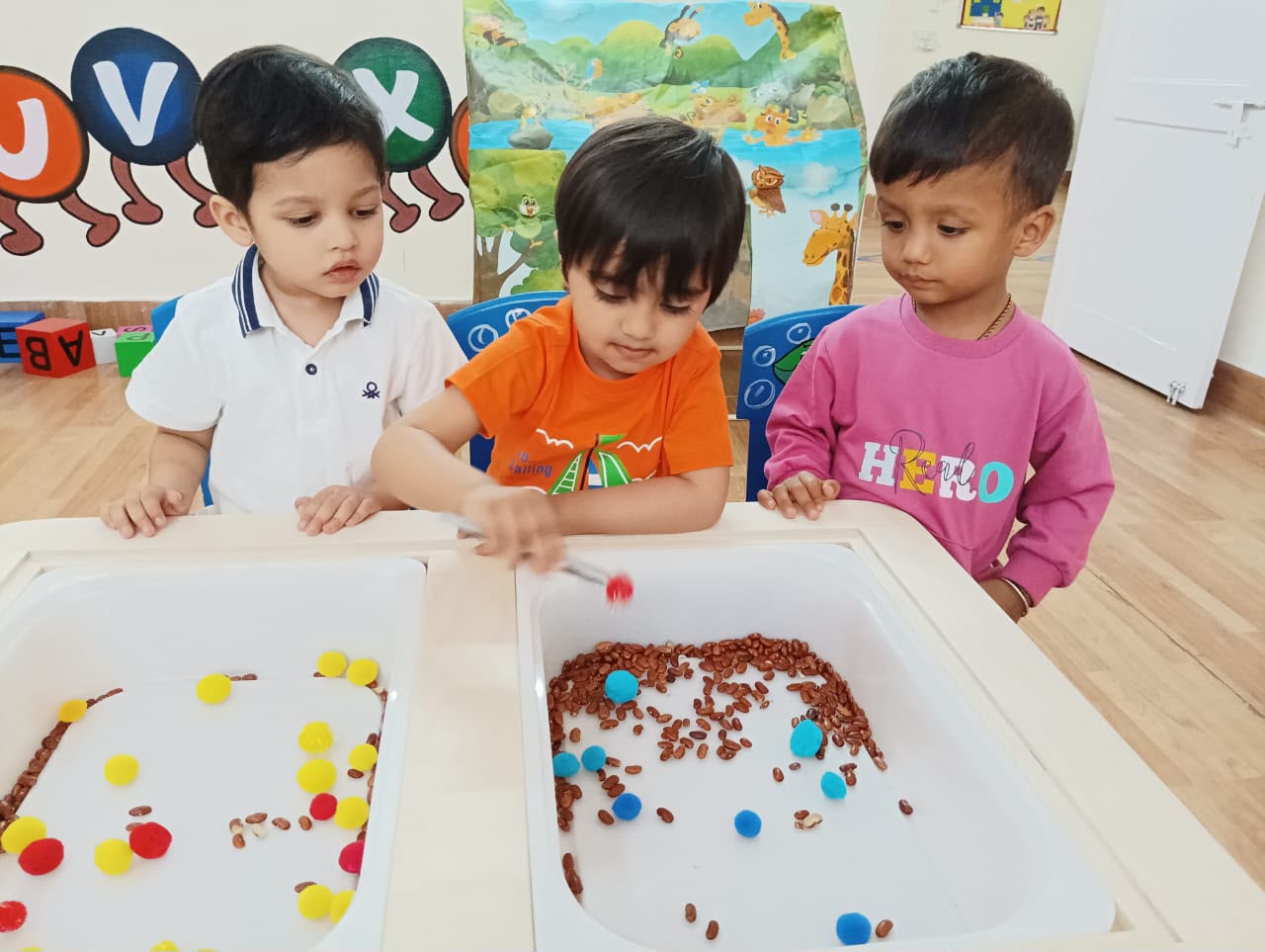 Diverse preschoolers laughing and playing with colorful wooden blocks